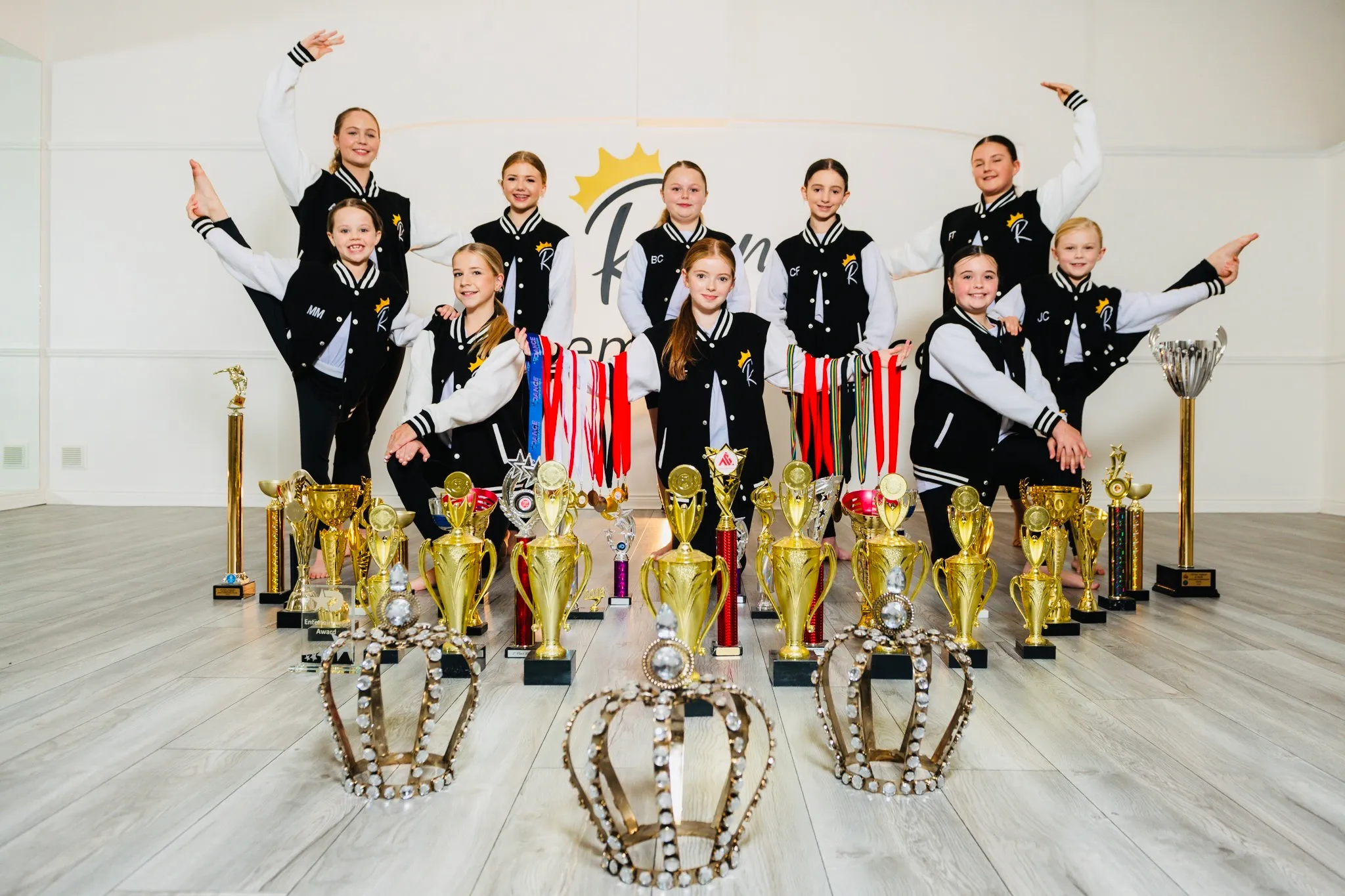 Dance competition trophy and awards on display, stage lighting, abstract dance elements, no human shapes