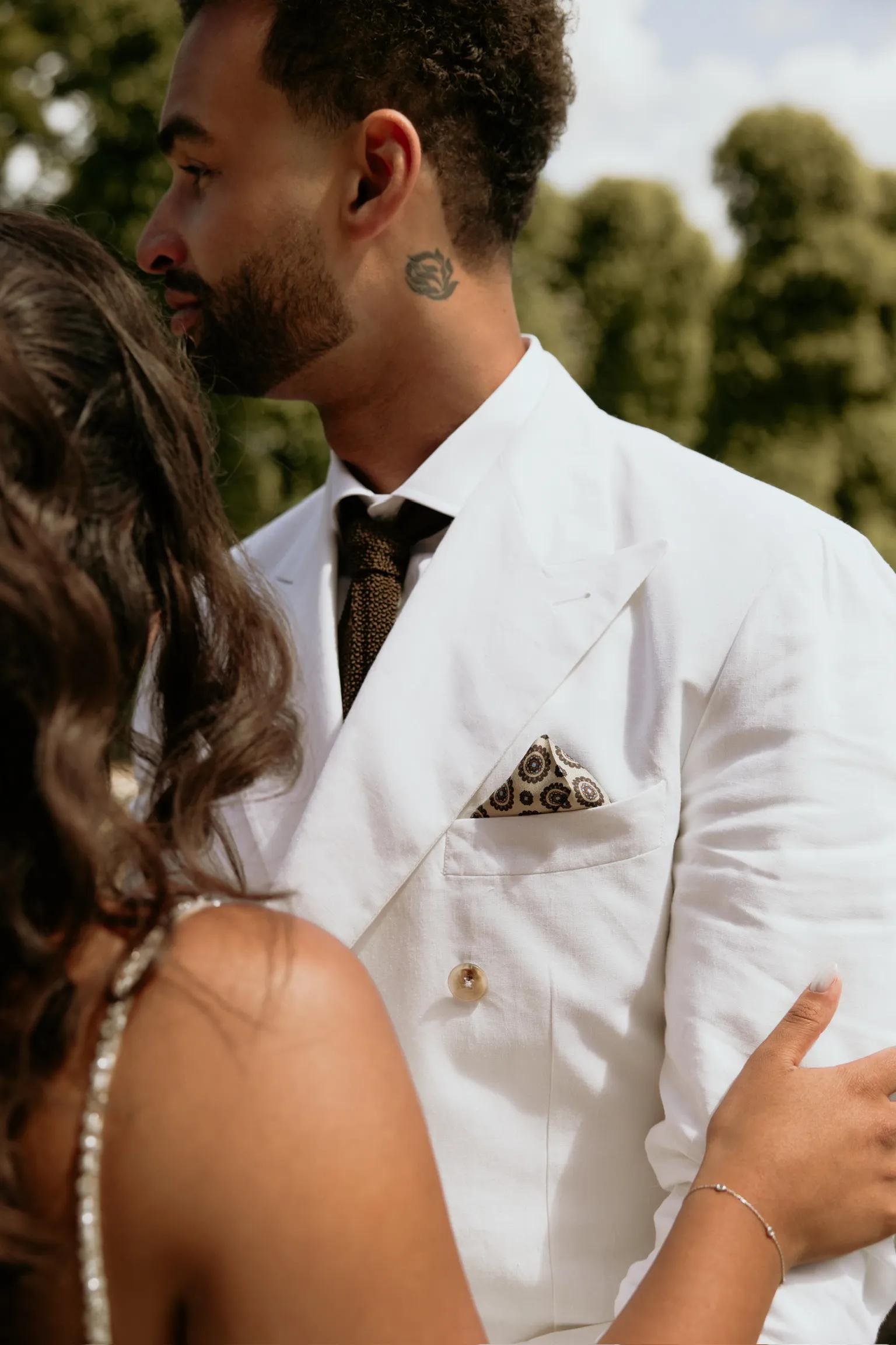 Professional business look for spring featuring elegant menswear items like suits and casual jackets displayed outdoors, no human faces or identifiable features.