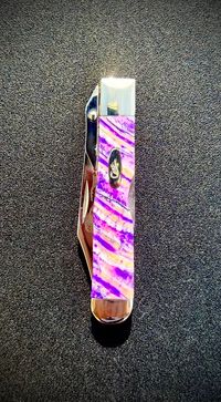 Mammoth tooth inlay knife with stabilized fossil handle material, showcasing natural prehistoric patterns and rich earthy tones, crafted for custom knifemaking and collectors