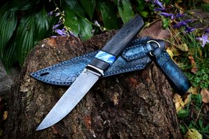 Mammoth tooth inlay knife with stabilized fossil handle material, showcasing natural prehistoric patterns and rich earthy tones, crafted for custom knifemaking and collectors