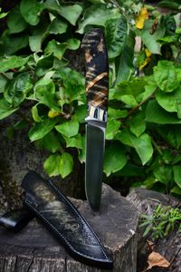 Mammoth tooth inlay knife with stabilized fossil handle material, showcasing natural prehistoric patterns and rich earthy tones, crafted for custom knifemaking and collectors