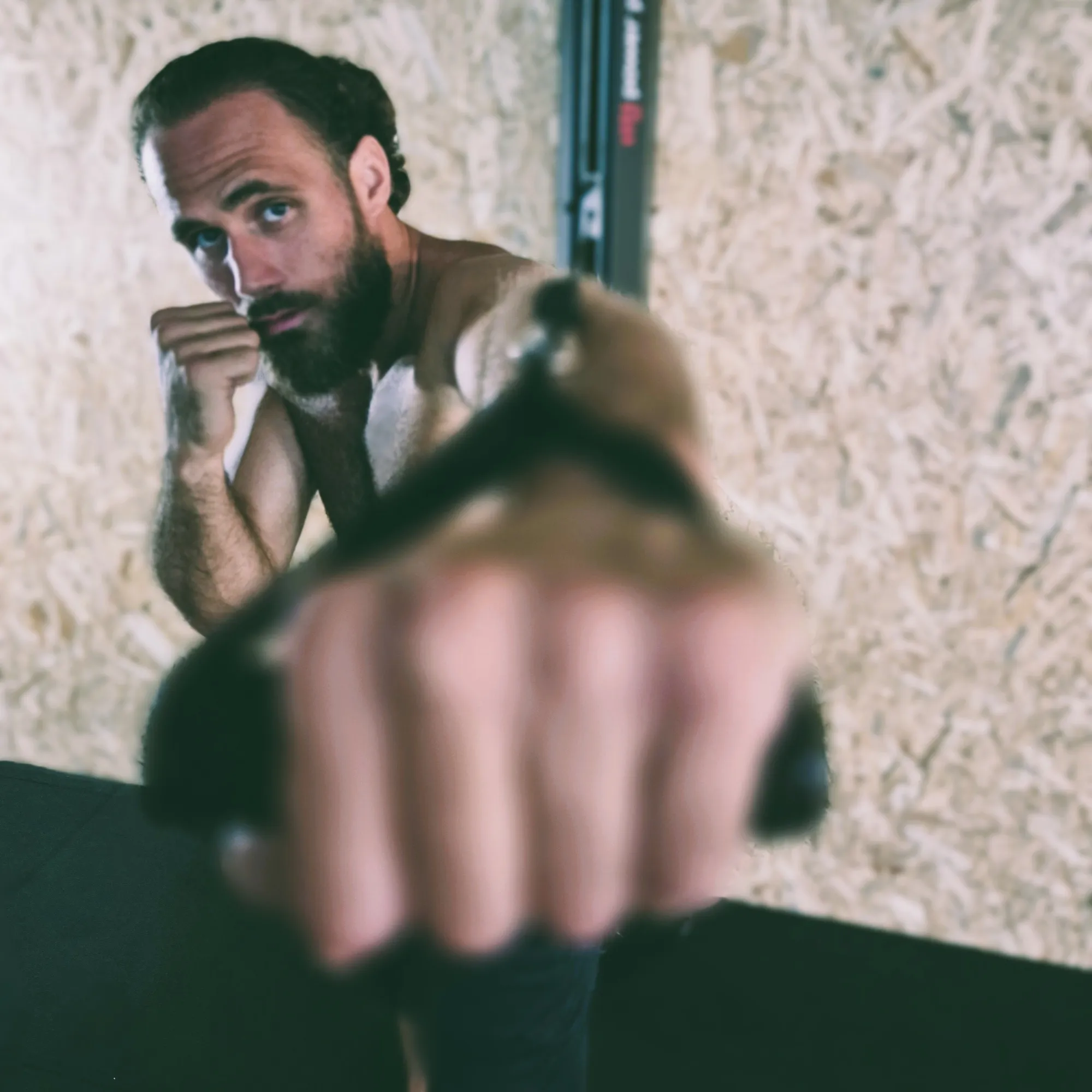 Boxing punch technique showing a jab punch in a gym setting with training equipment. Do not generate human shapes.