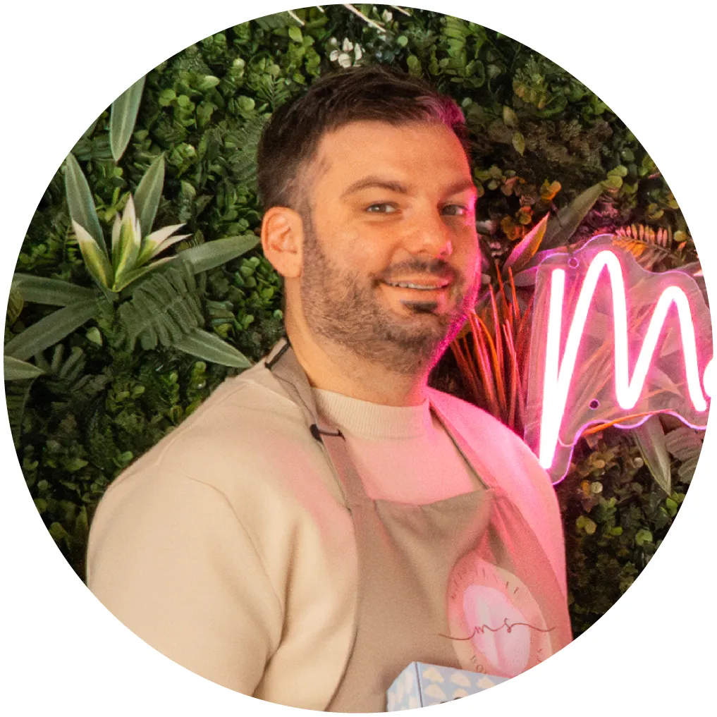 Portrait of a team member with flowers, indoor setting, warm tones - no human face identification