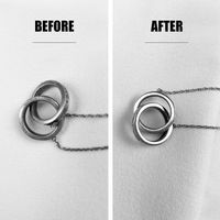Side-by-side before and after comparison of a tarnished silver necklace restored to a bright polish.