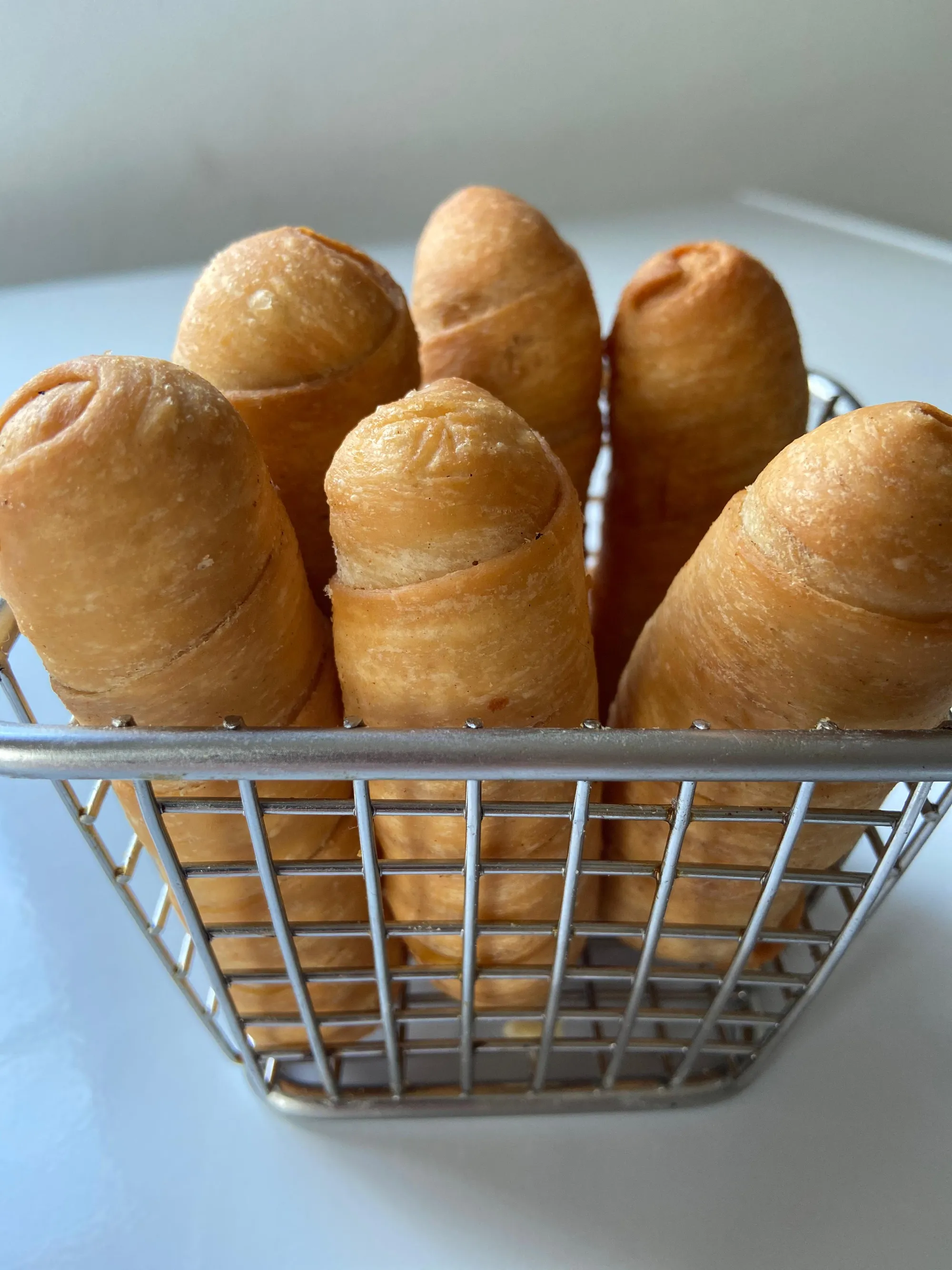 Traditional arepas with various fillings displayed on a wooden board, warm lighting. No human shapes.